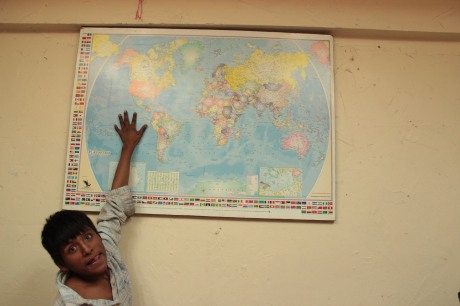 9.Rosalindo points out Mexico on a wall-map in an Irish-Catholic run rehab centre in Mexico City. Under pressure, these pictures were taken to be sent off to the Centro Cultural de España as first-edit photograph exhibits.