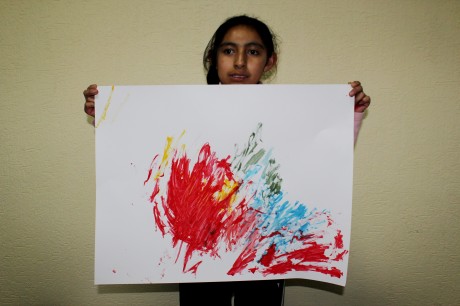 During the final project that we initially based on ‘Beauty’, Mariana holds up her version of a painting I had told them to do which would put “how they felt onto paper”. This was to experiment with motion and colour in images.